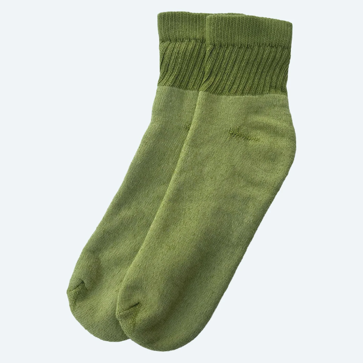 Pansy organic cotton short socks in Moss green, laid flat with ribbed cuffs.