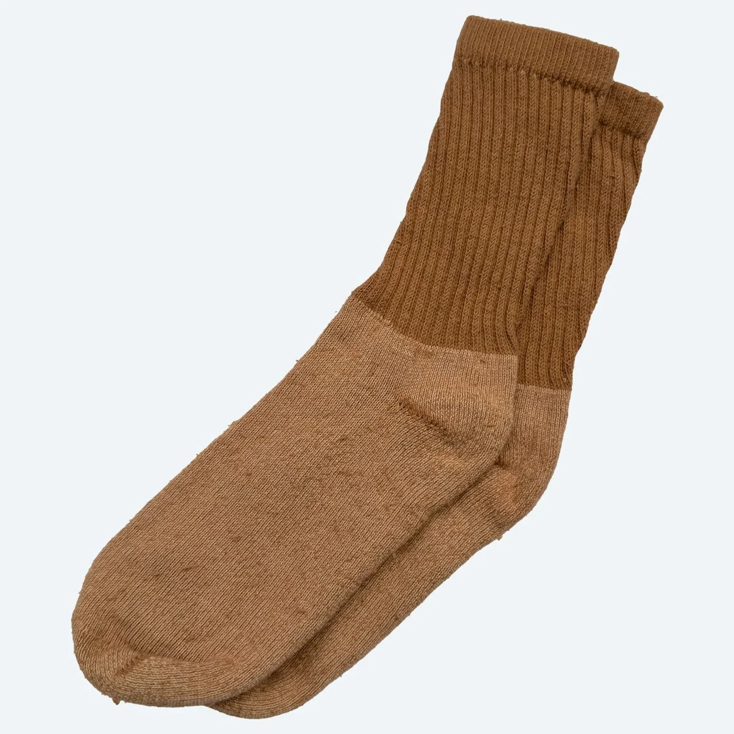 Socks in Almond, laid flat with one overlapping the other.