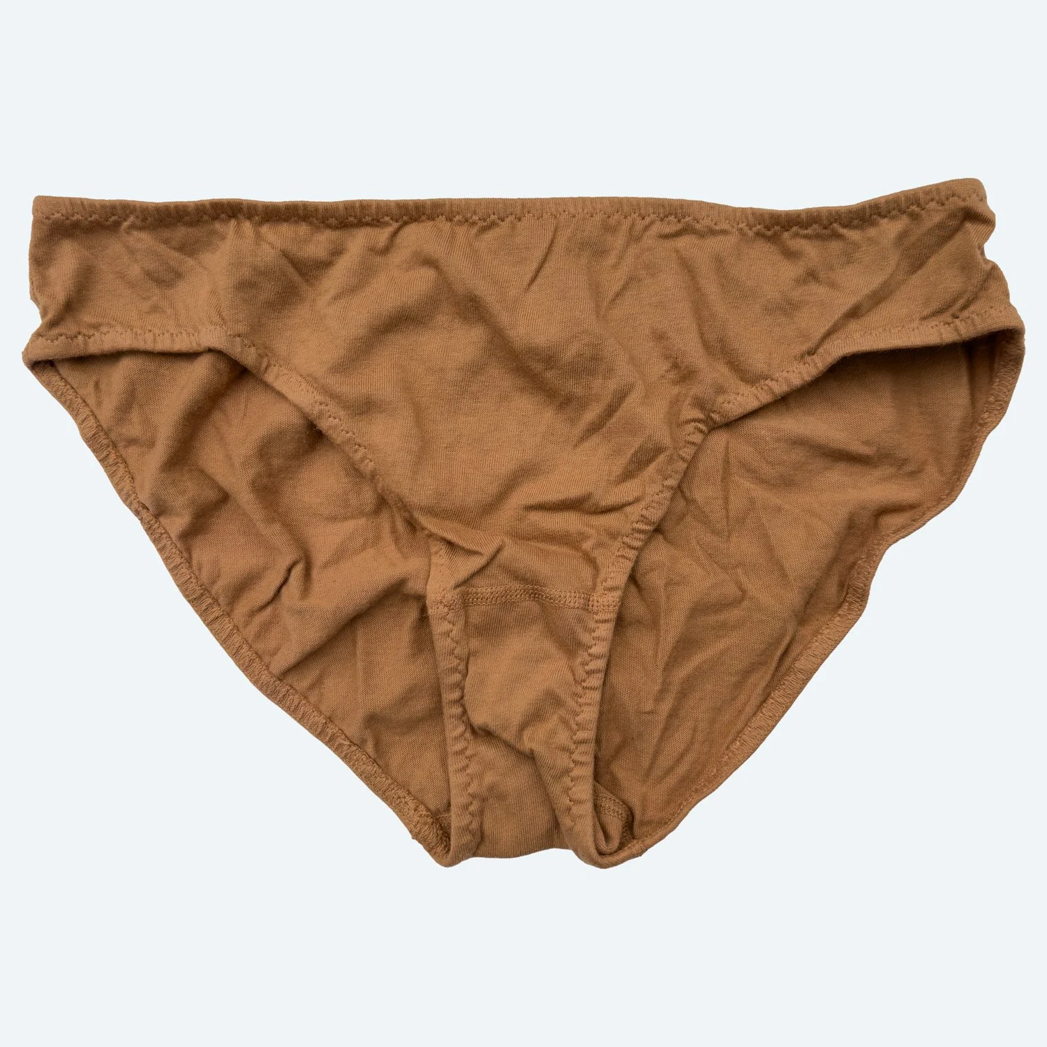 Front view of Pansy organic cotton Low Rise underwear in Almond, laid flat to show the low waistband and curved leg openings.
