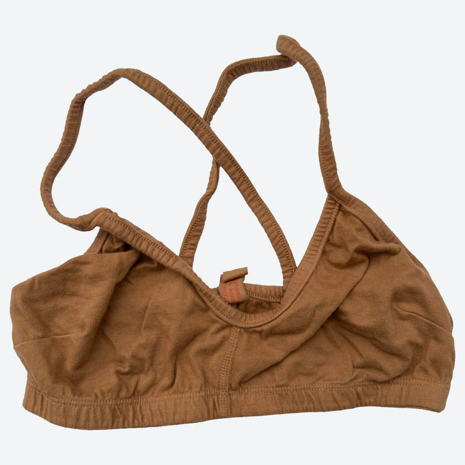 Cross Bra in Almond, laid flat, front view.