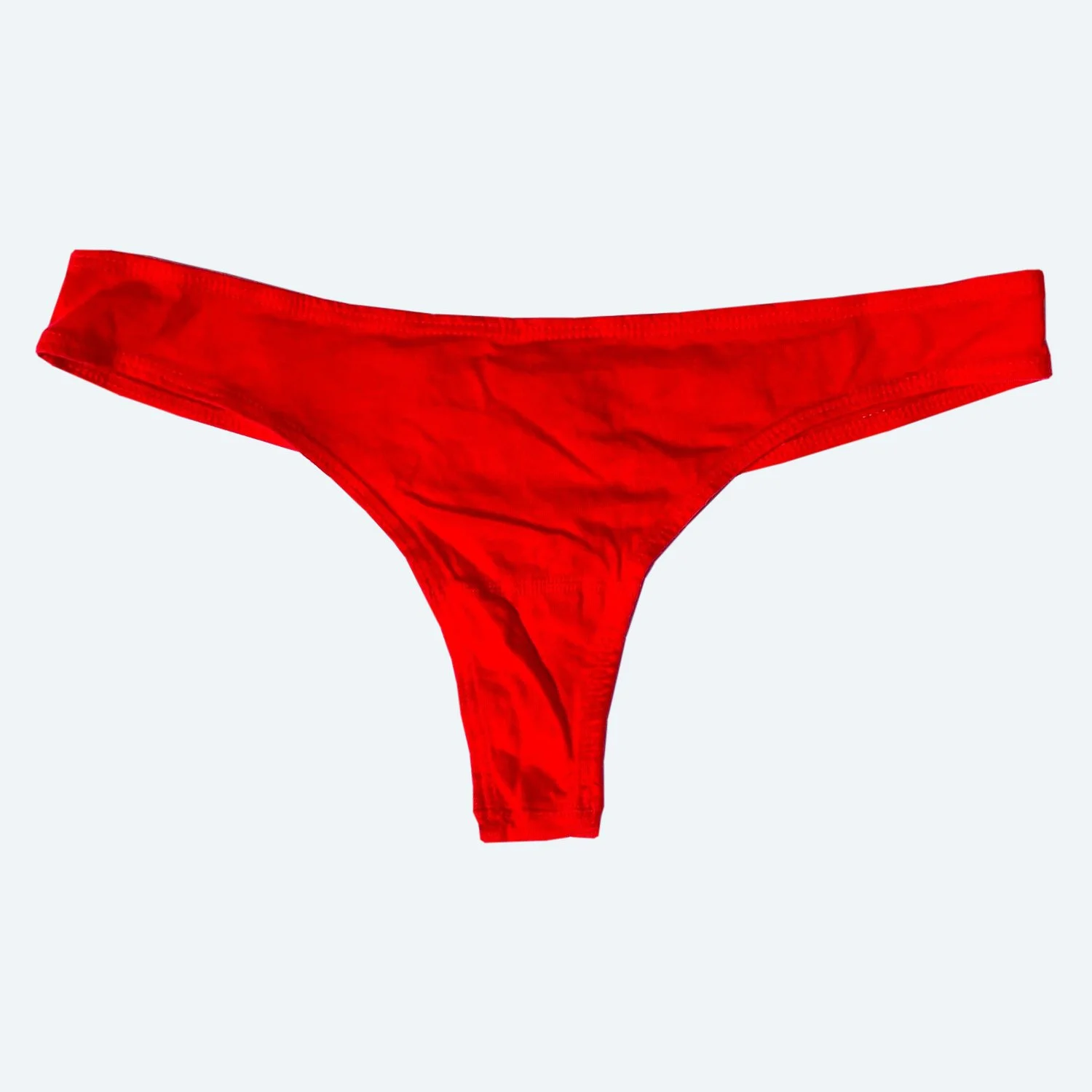Front flat view of the Pansy organic cotton thong in Red