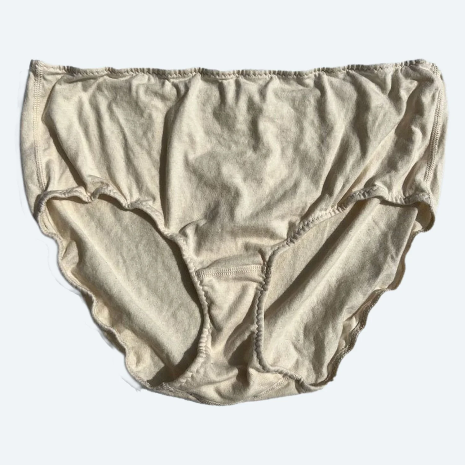 Front view of Pansy organic cotton High Rise underwear in Natural, laid flat to show the waistband and full-coverage shape.