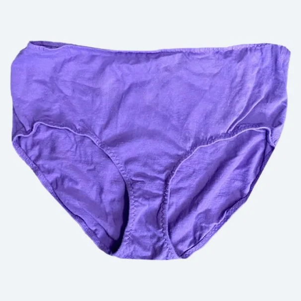 Flat lay of Pansy high rise underwear in lilac purple on a pale blue-gray background.
