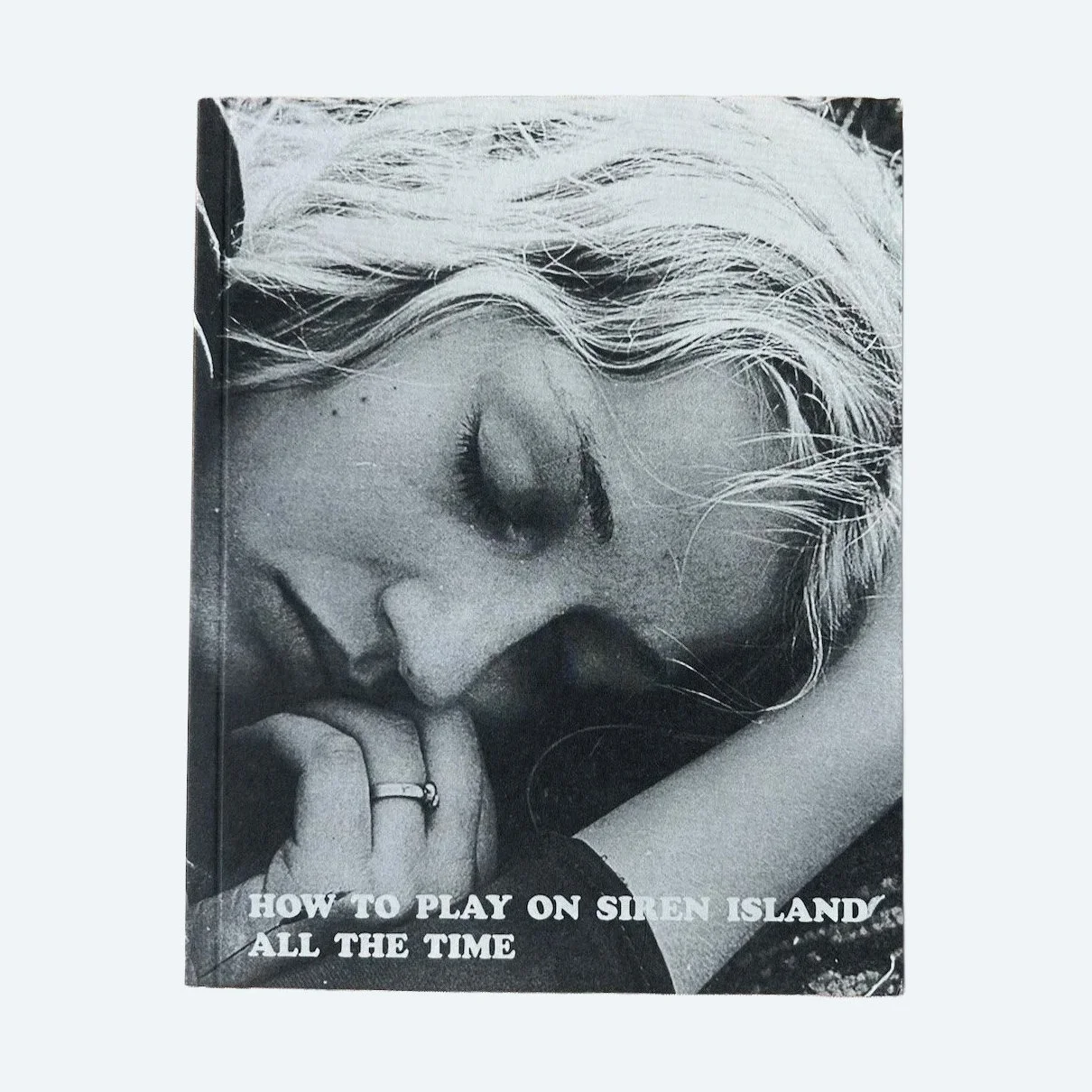 Front cover of How to Play on Siren Island All the Time by Rachel Corry, featuring a black-and-white portrait.