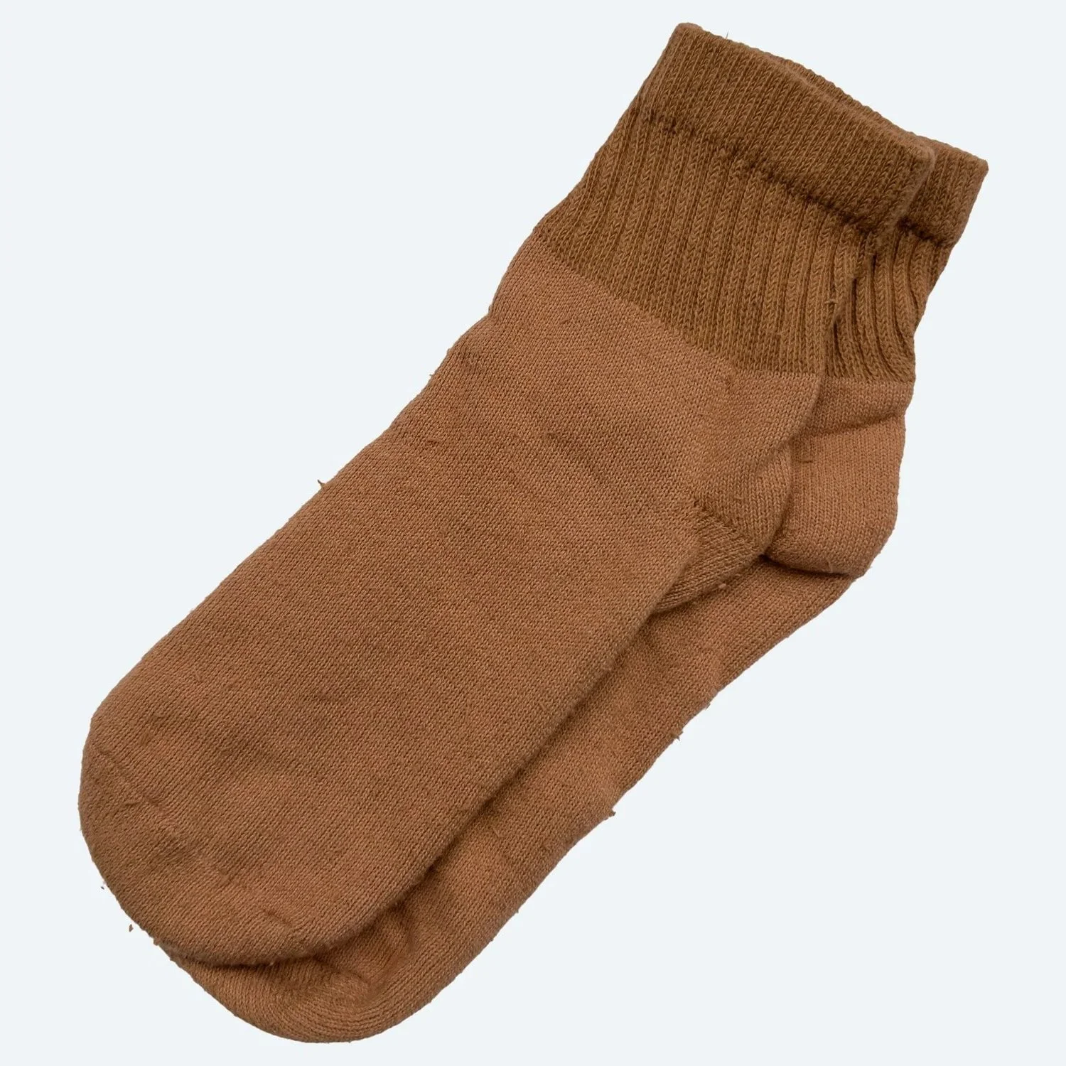 A pair of Pansy organic cotton short socks in Almond pink, laid flat with ribbed cuffs.