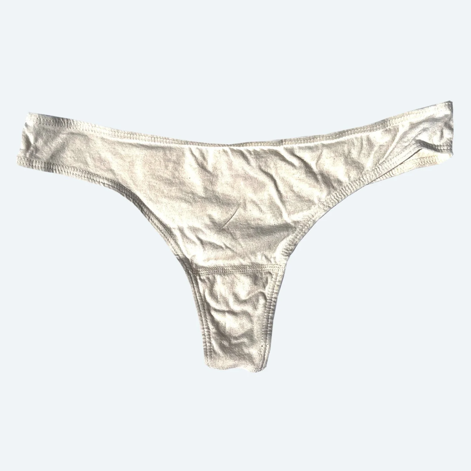 Flat view of the Pansy organic cotton thong in Natural