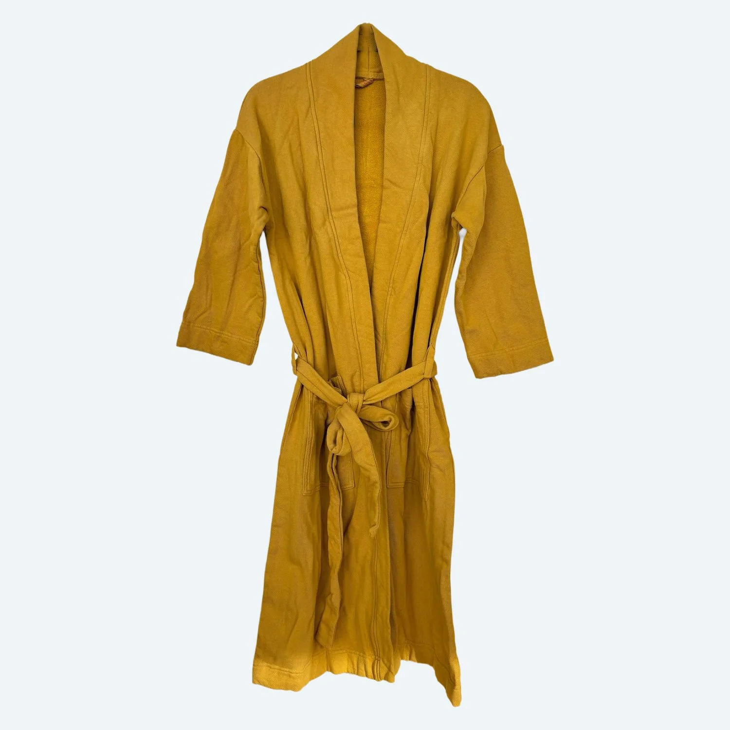 Front view of the Pansy organic cotton Fleece Robe in Gold, showing its open neckline, sleeves and tied belt.