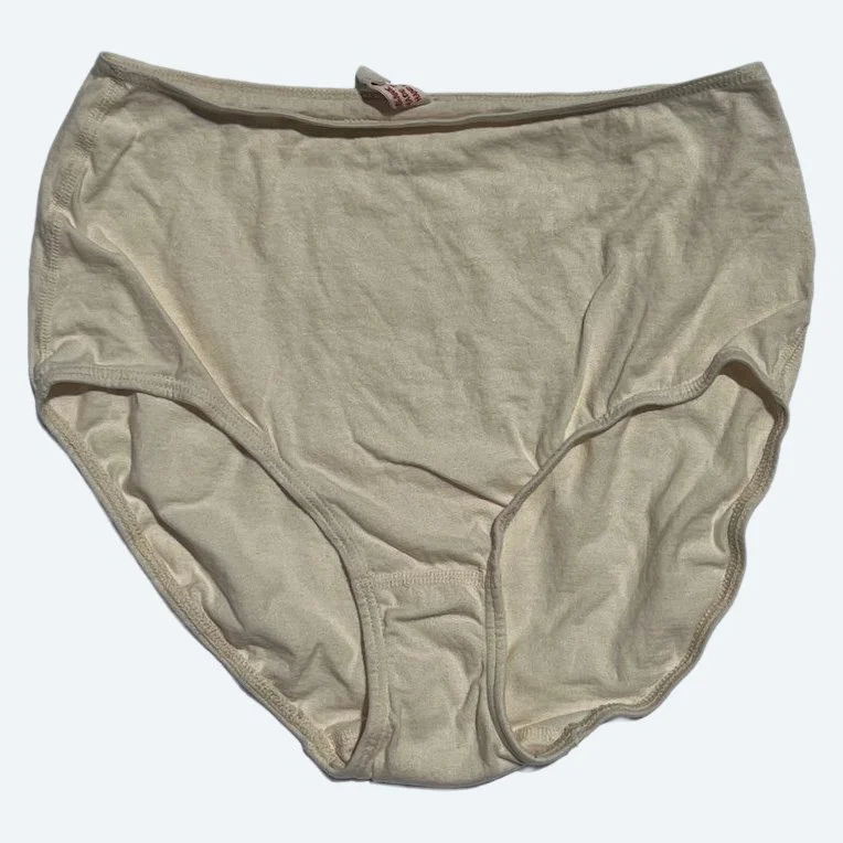 Flat lay of Pansy short xtra high rise underwear in natural on a pale blue-gray background.