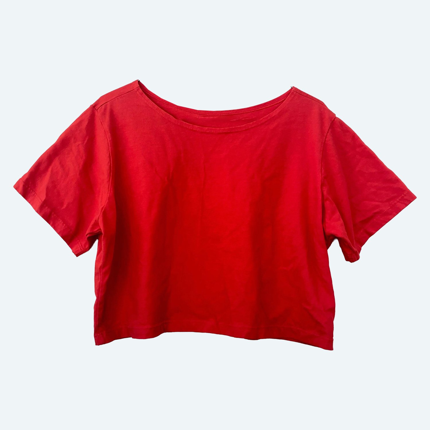Front view of the Pansy organic cotton Crop Top in Red, showing its wide neckline and short sleeves.
