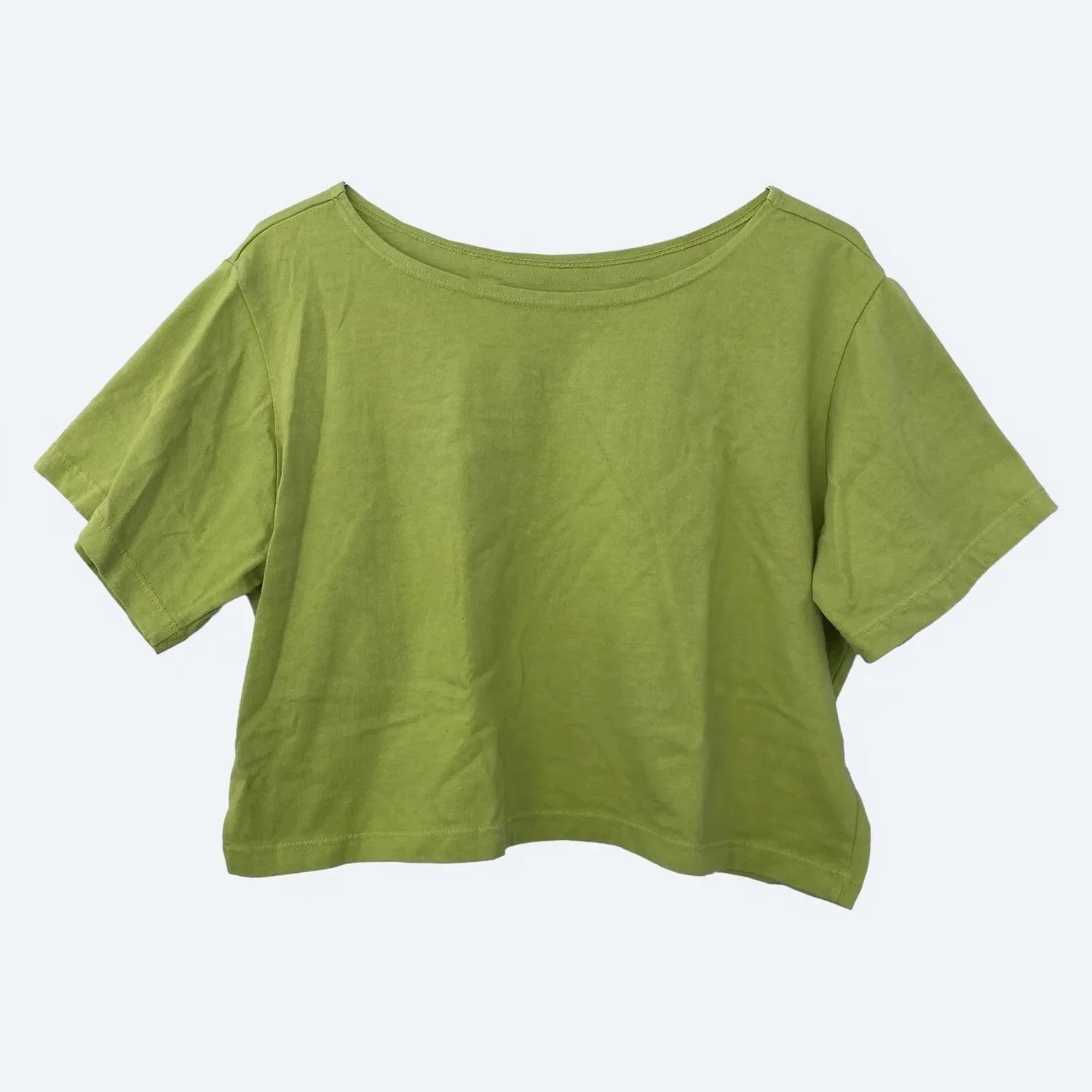 Pansy Crop Top in Moss green, laid flat from the front with a wide neckline and short sleeves.