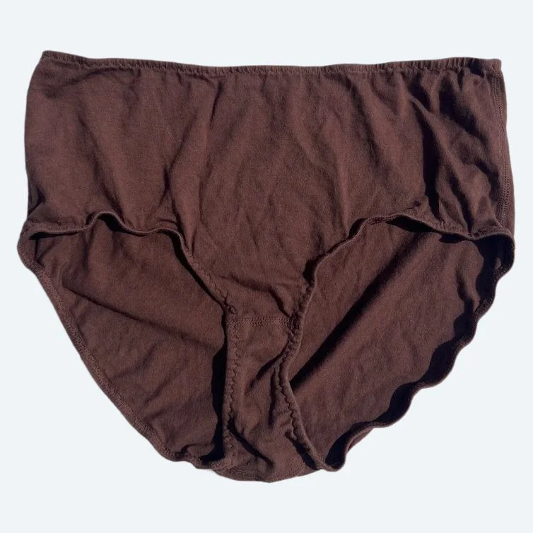 Flat lay of Pansy high rise underwear in cocoa brown on a pale blue-gray background.