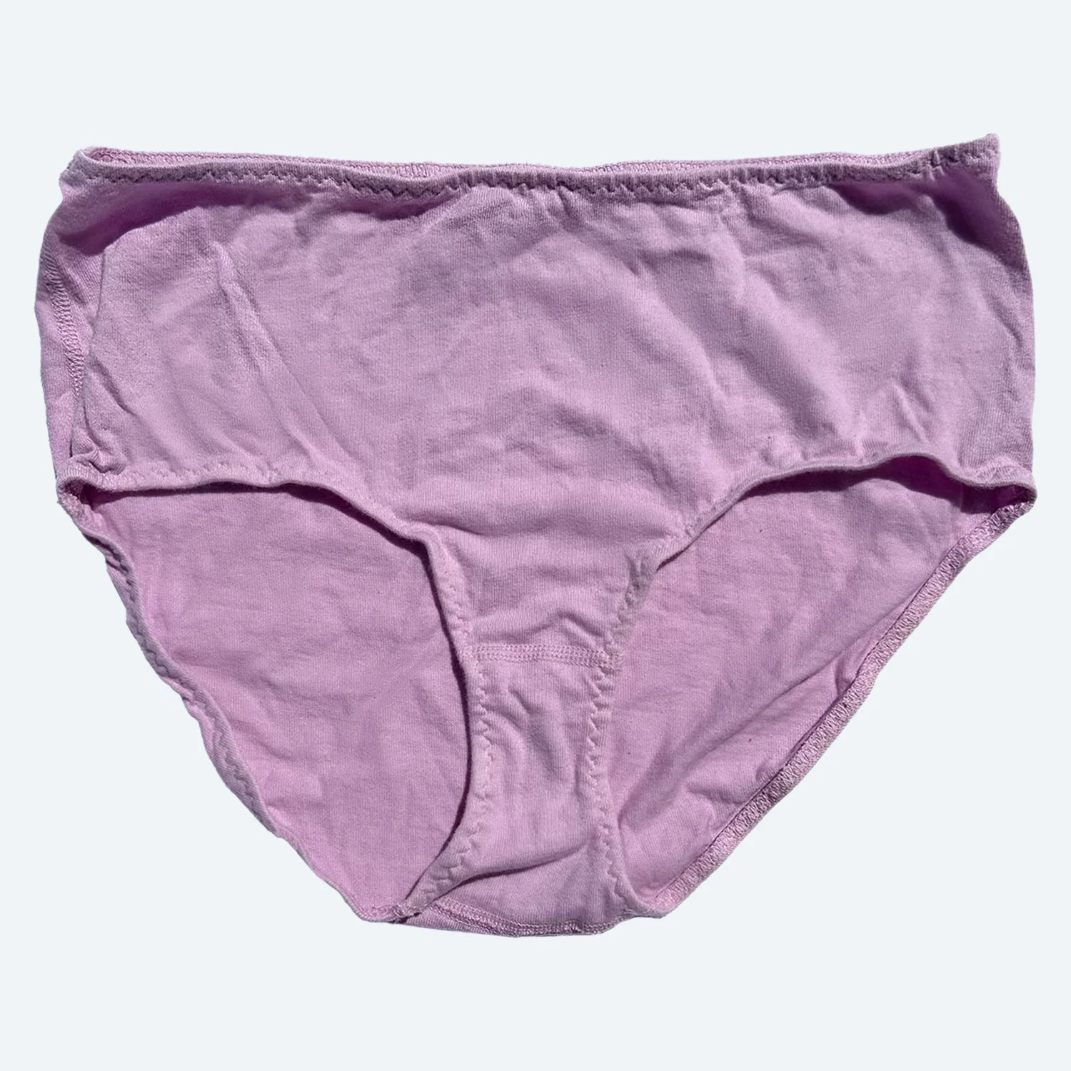 Front view of Pansy organic cotton High Rise underwear in Blossom pink, laid flat to show the waistband and full-coverage shape.