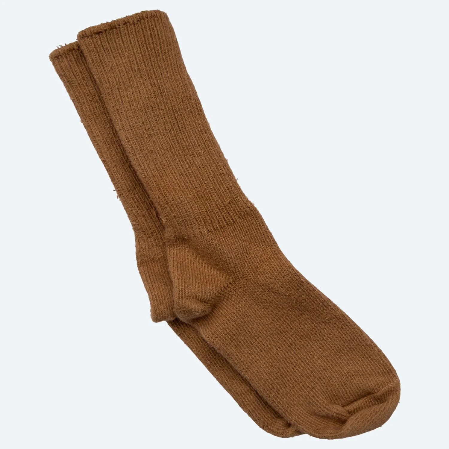 A pair of Pansy organic cotton crew socks in Almond brown, laid flat with ribbed cuffs.