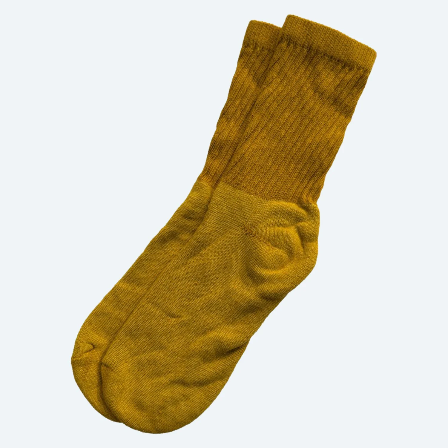 Pansy organic cotton tube socks in Gold, laid flat with ribbed cuffs.