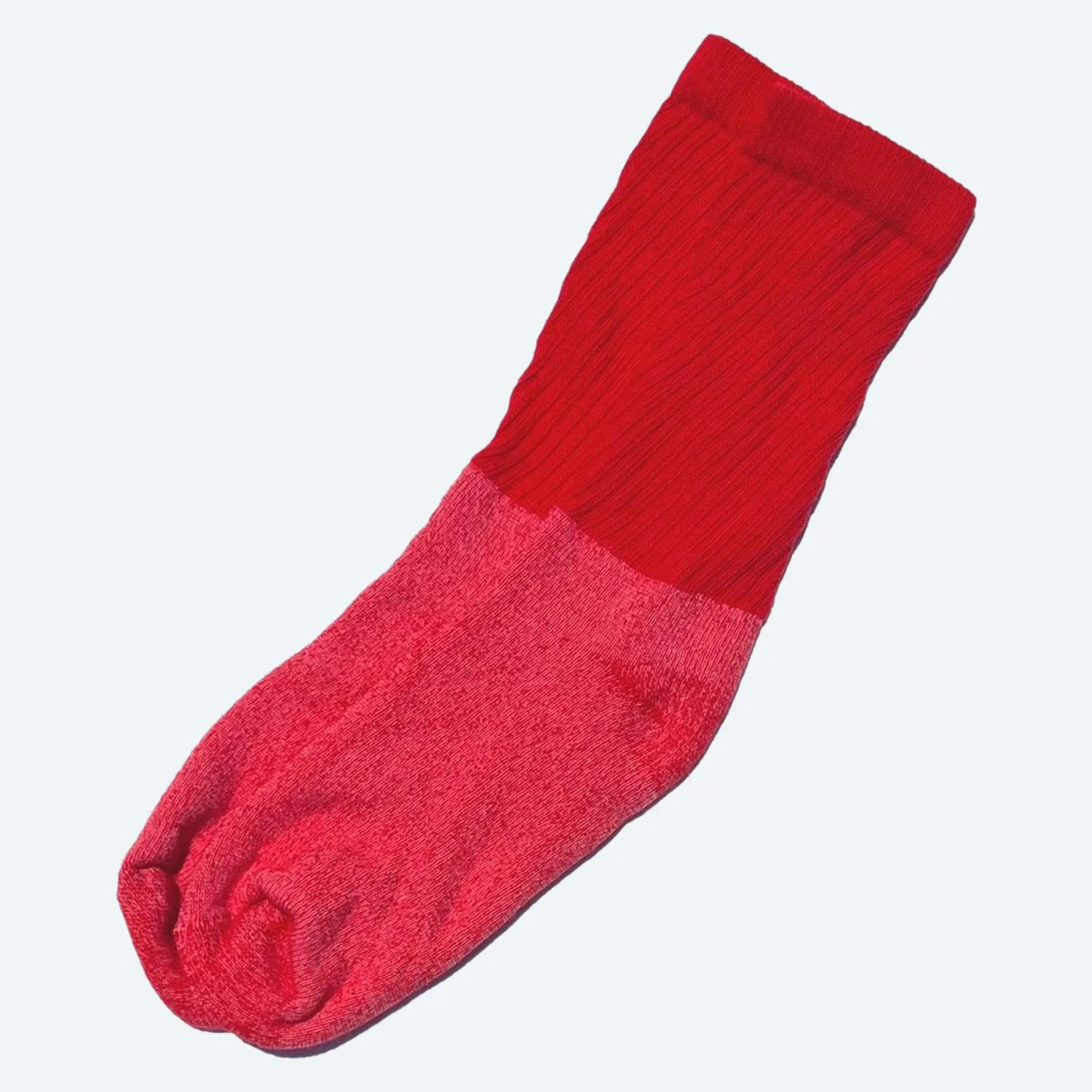 Pansy organic cotton tube socks in Red, laid flat with ribbed cuffs.
