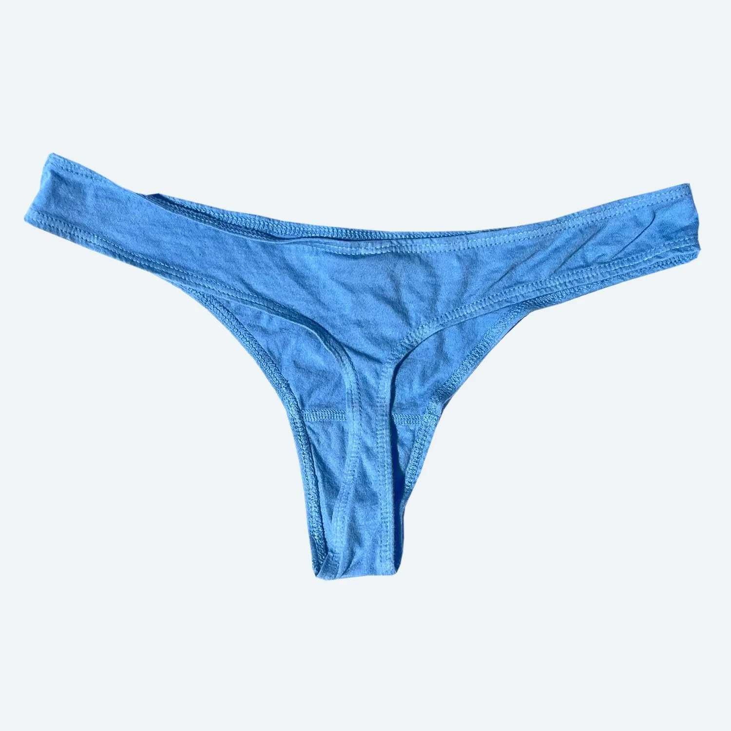 Rear flat view of the Pansy organic cotton thong in Sky