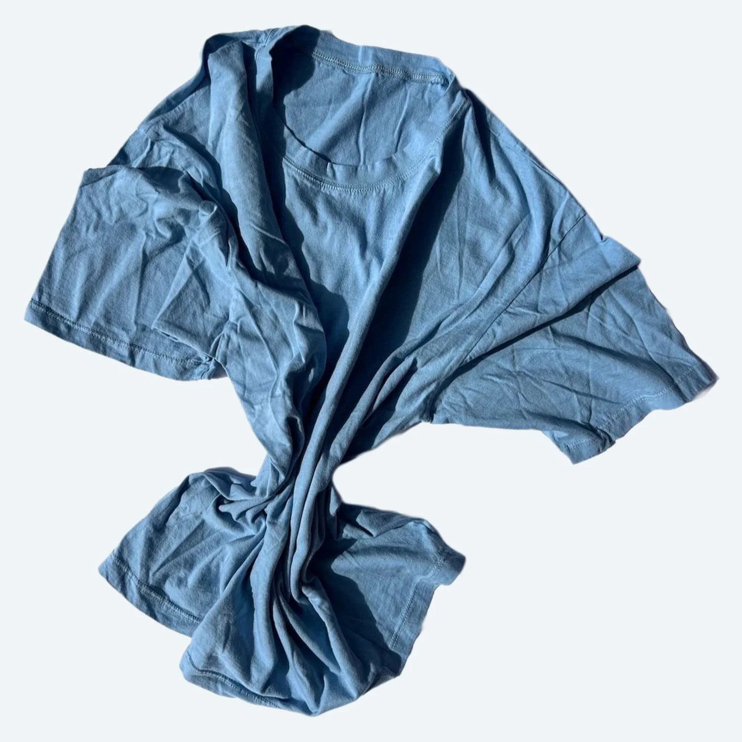 Pansy organic cotton T-shirt in Sky blue, loosely gathered to show the crew neck, short sleeves and soft fabric drape.