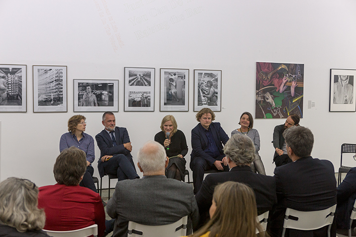 Discussion at the opening ceremony, with my painting in the background