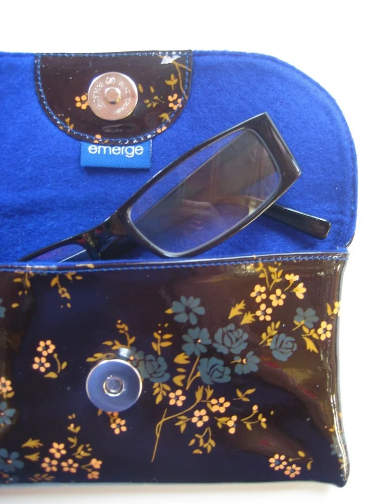 Navy floral patent leather clutch