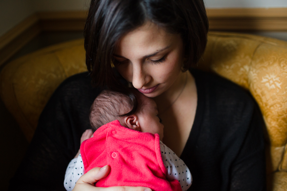 ©MariaManco_Mom holds newborn against chest