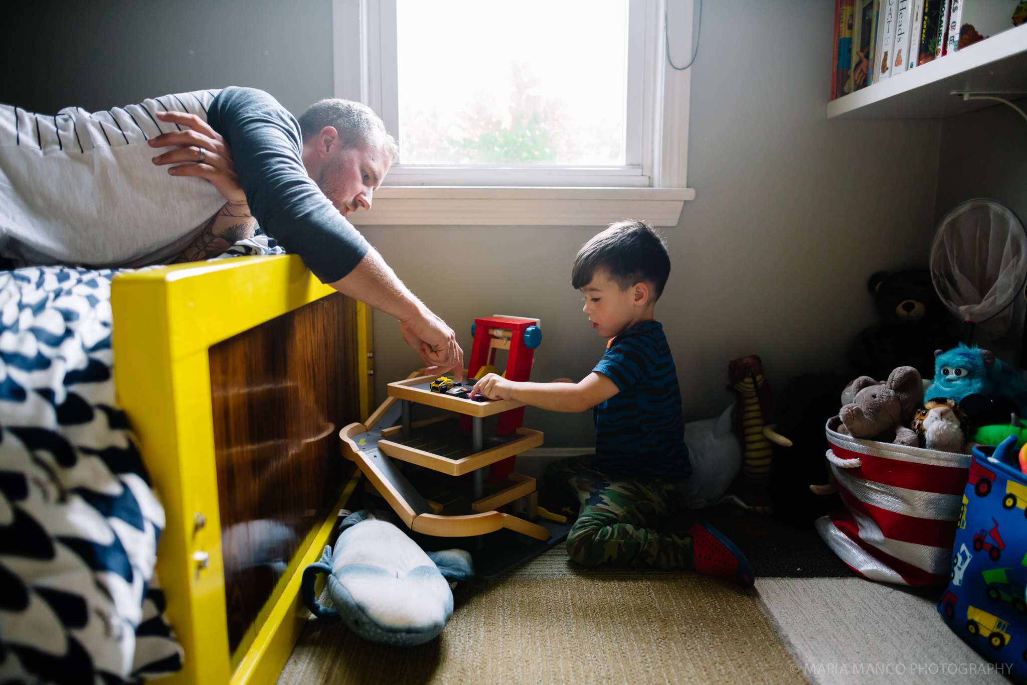 ©MariaManco _ Father and son playing together in child's room