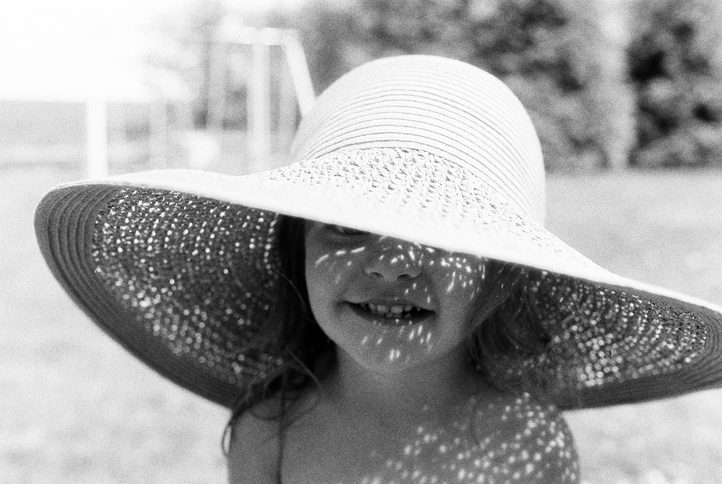 For these hat ones I put the meter under the hat in front of their face. In the even lit one, she was standing in open shade f4.0 1/250. In the dappled sunlight ones I had them stand in the sun. f4.0 1/400