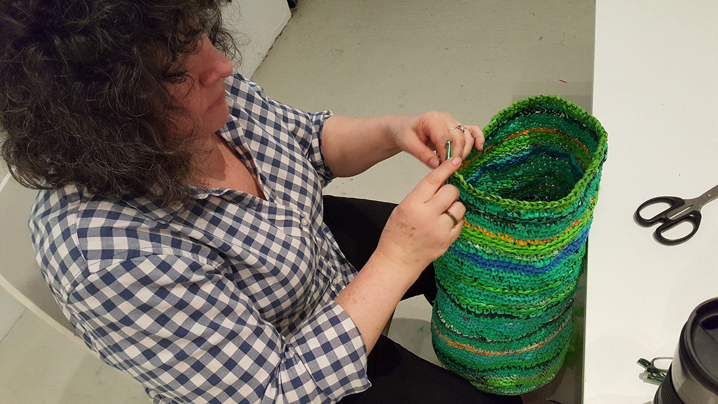 Antonia Perez making a piece at Cuchifritos Gallery Image Courtesy of Artist