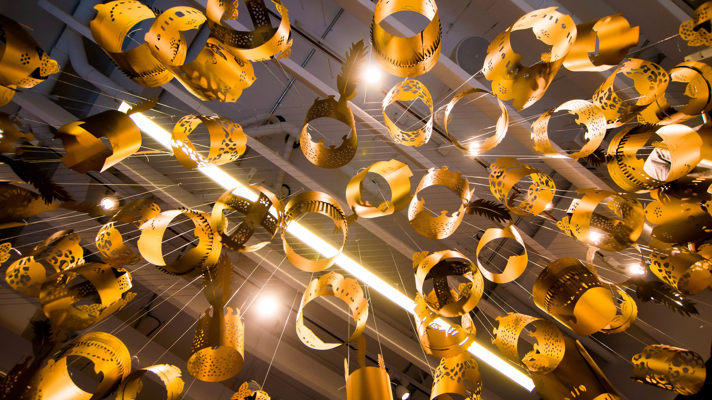 The exhibit takes shape as more crowns are added. 