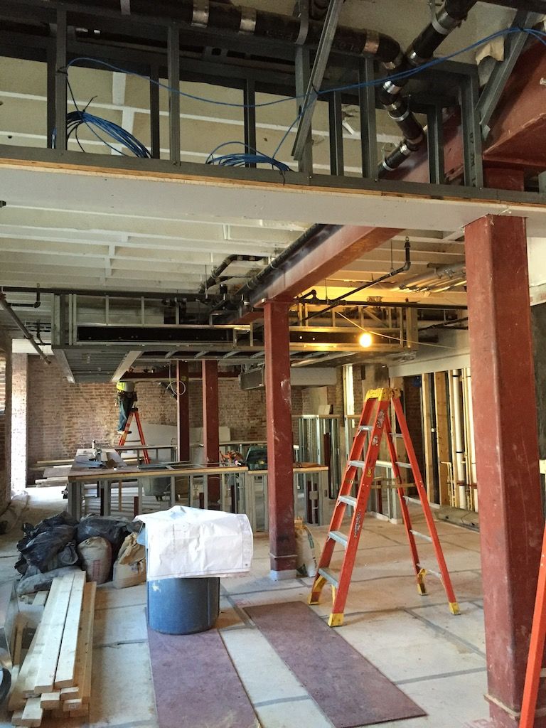 A view of the restaurant portion of the lobby. All the exposed brick will remain.