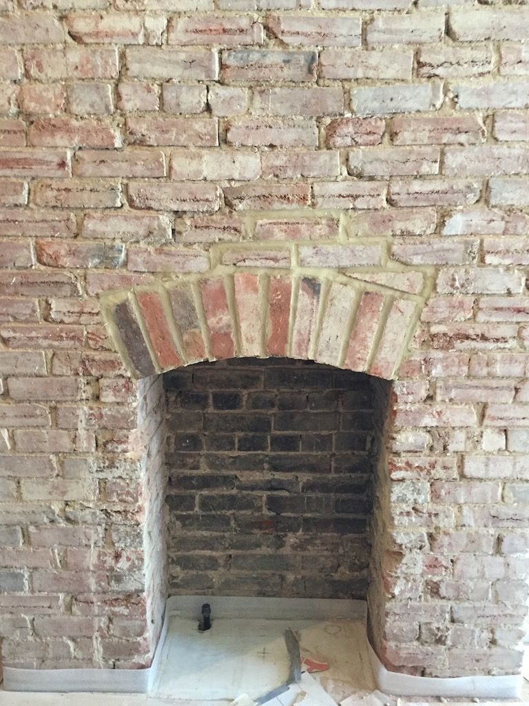 Workers unearthed this original fireplace, previously hidden behind a wall. It will remain exposed in the hotel bar area.