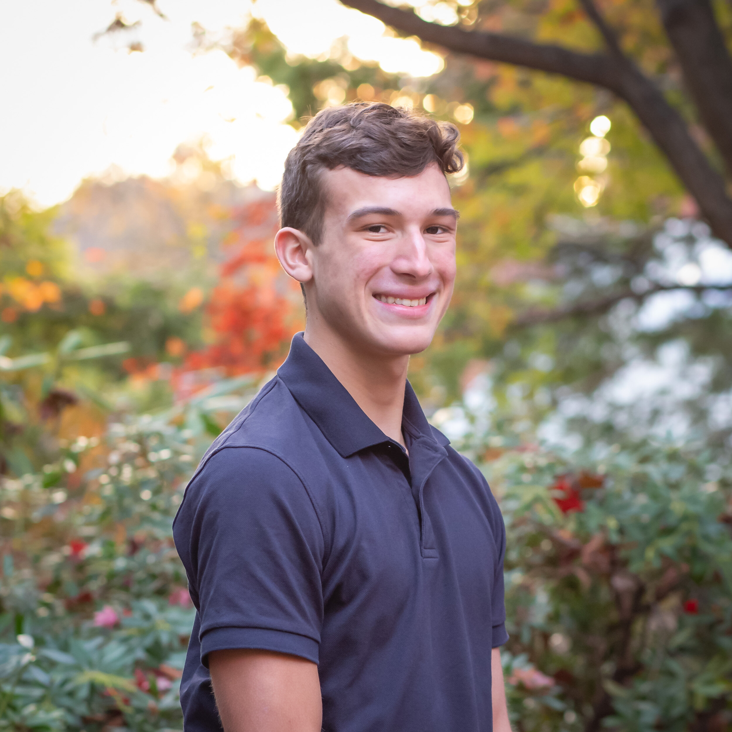 sea green photography, rhode island senior portrait, city, autumn, boy, smiling, standing