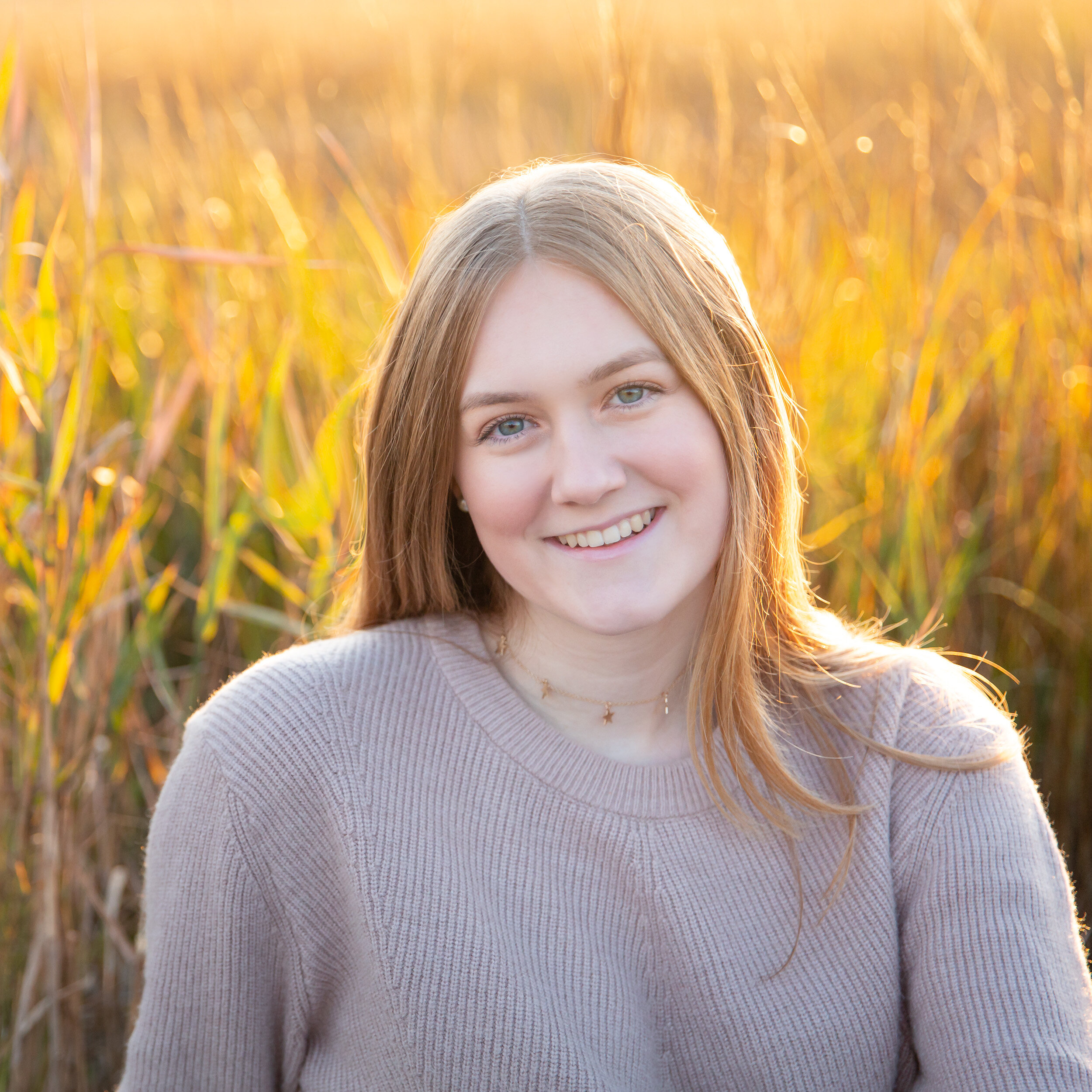 sea green photography, rhode island senior portrait, girl, smiling, outdoors, beach, sea grass, back light, sunset, smiling