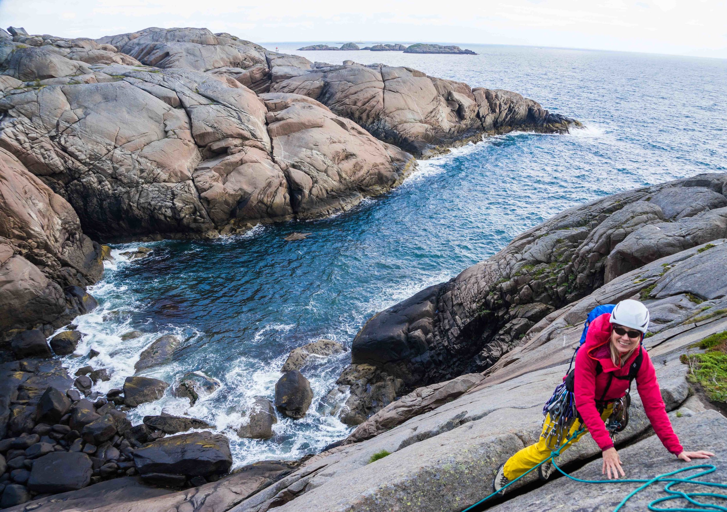 Rock climbing above the ocean in Lofoton