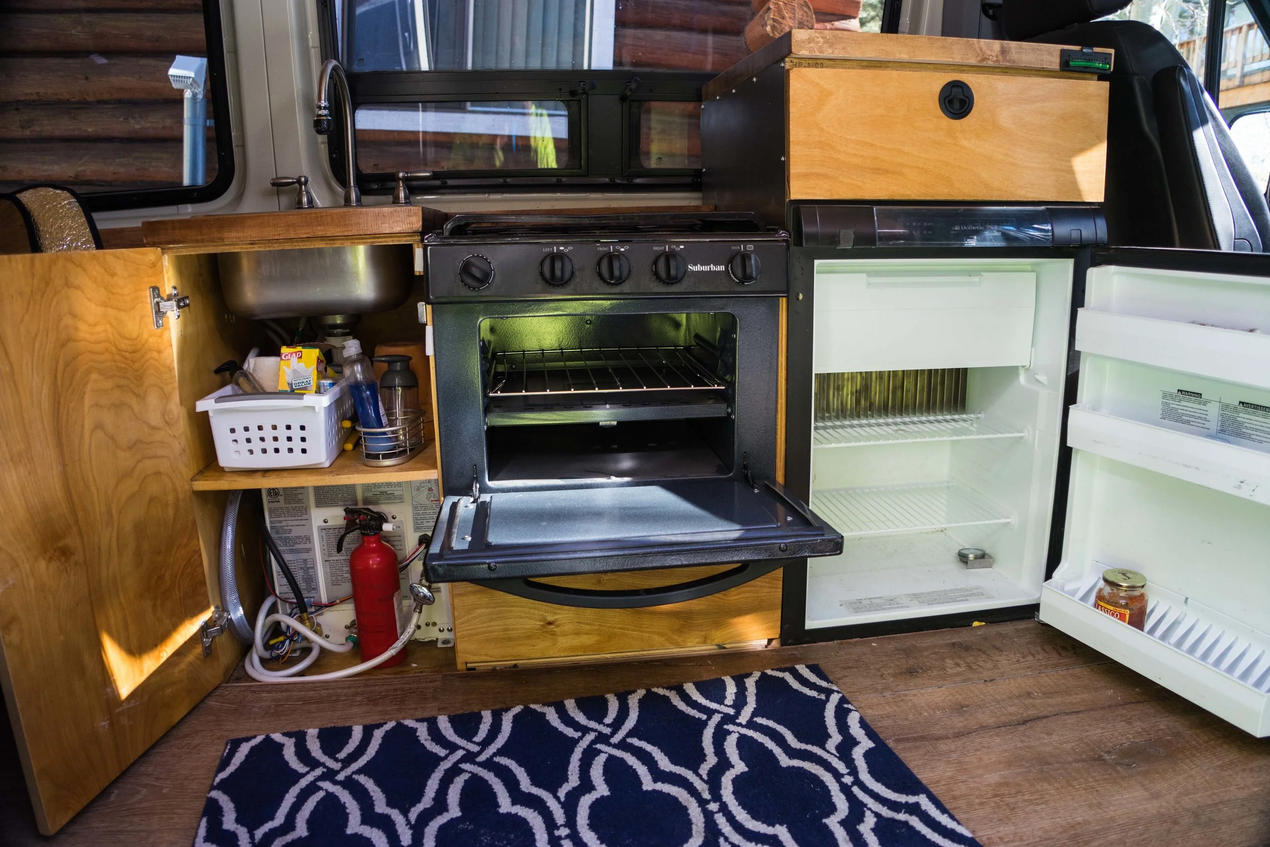 The kitchen. The water heater sits under the sink.