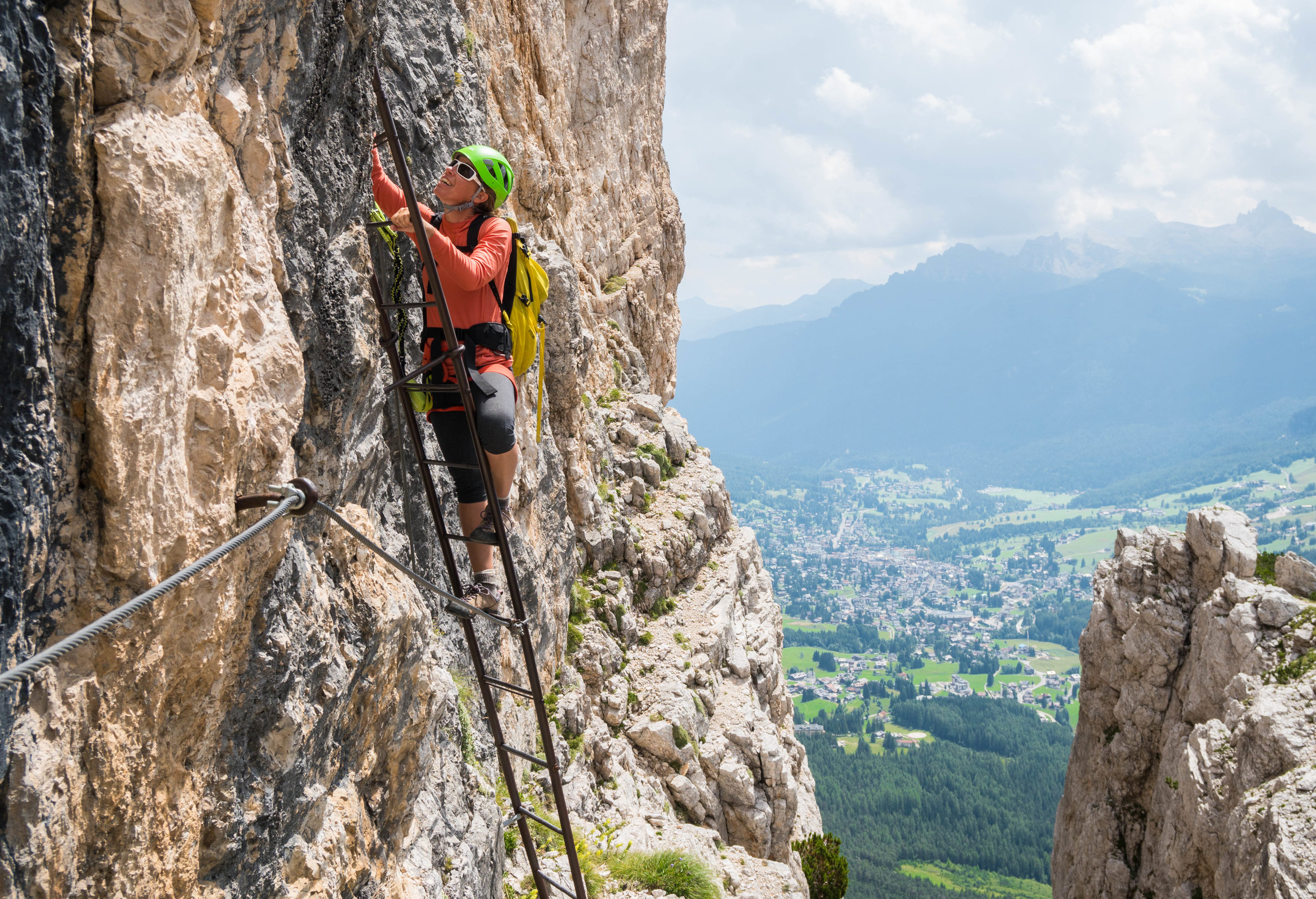 Climbing ladders on a via ferrata near Cortina