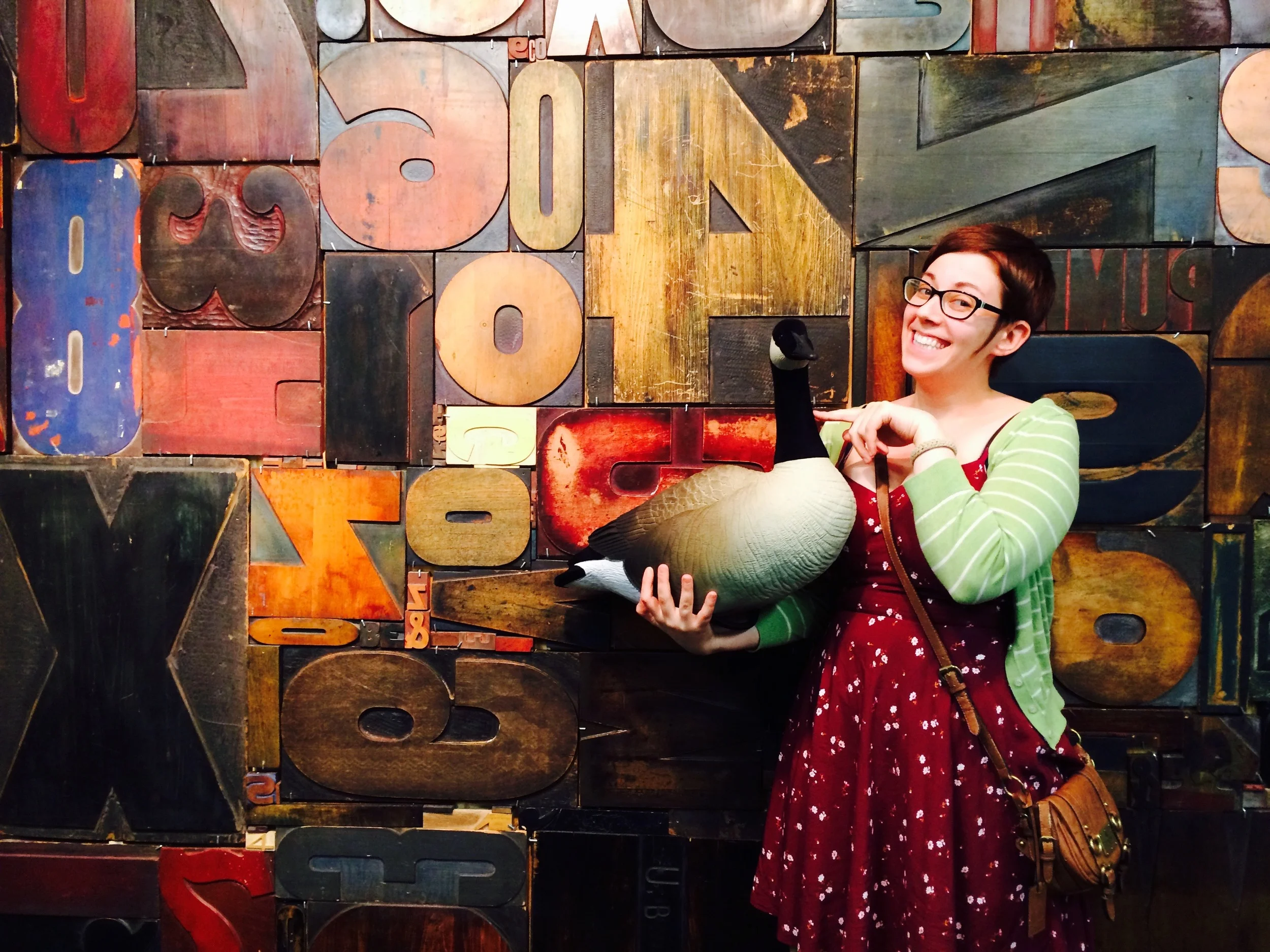 Alyse, pictured here with the ever elusive Wayz Goose at the 2015 Hamilton Woodtype Museum Wayzgoose. And yes, that is a giant wall of woodtype. 