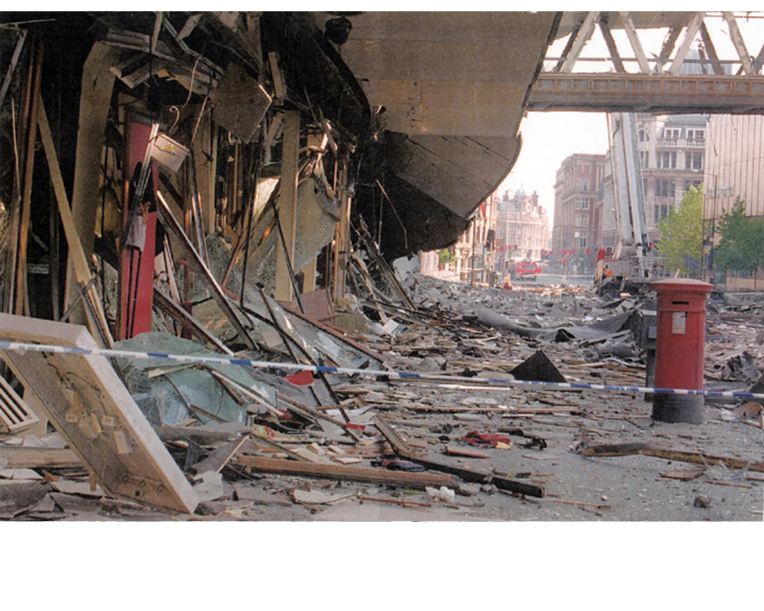 Video screen shot: Terrorist bombing provided the impetus for the redevelopment of Manchester. Story told through historical photos newspaper headlines, and ambient sounds. Photo of Corporation St.