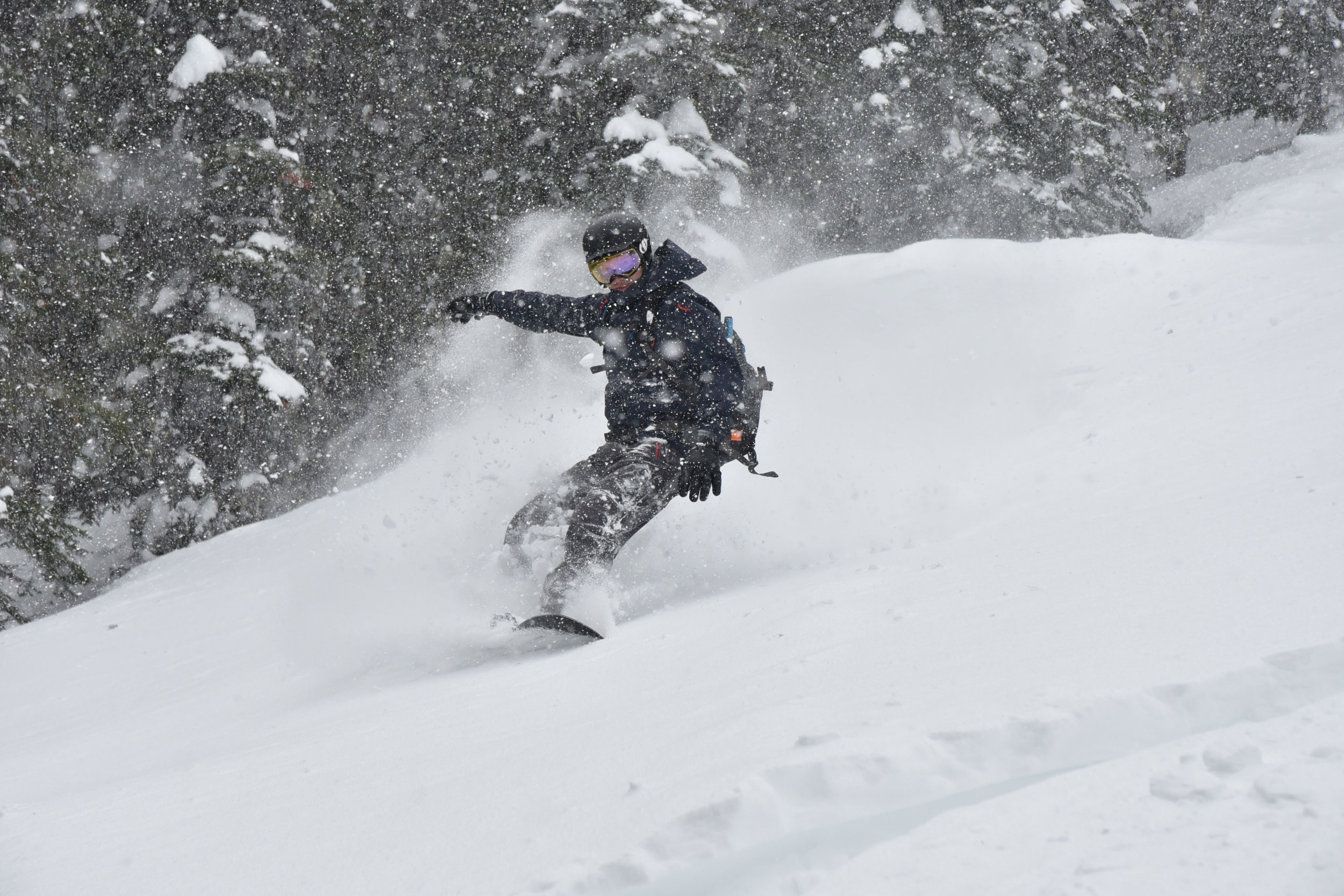 Snowboarding on a guided group trip in Canada.