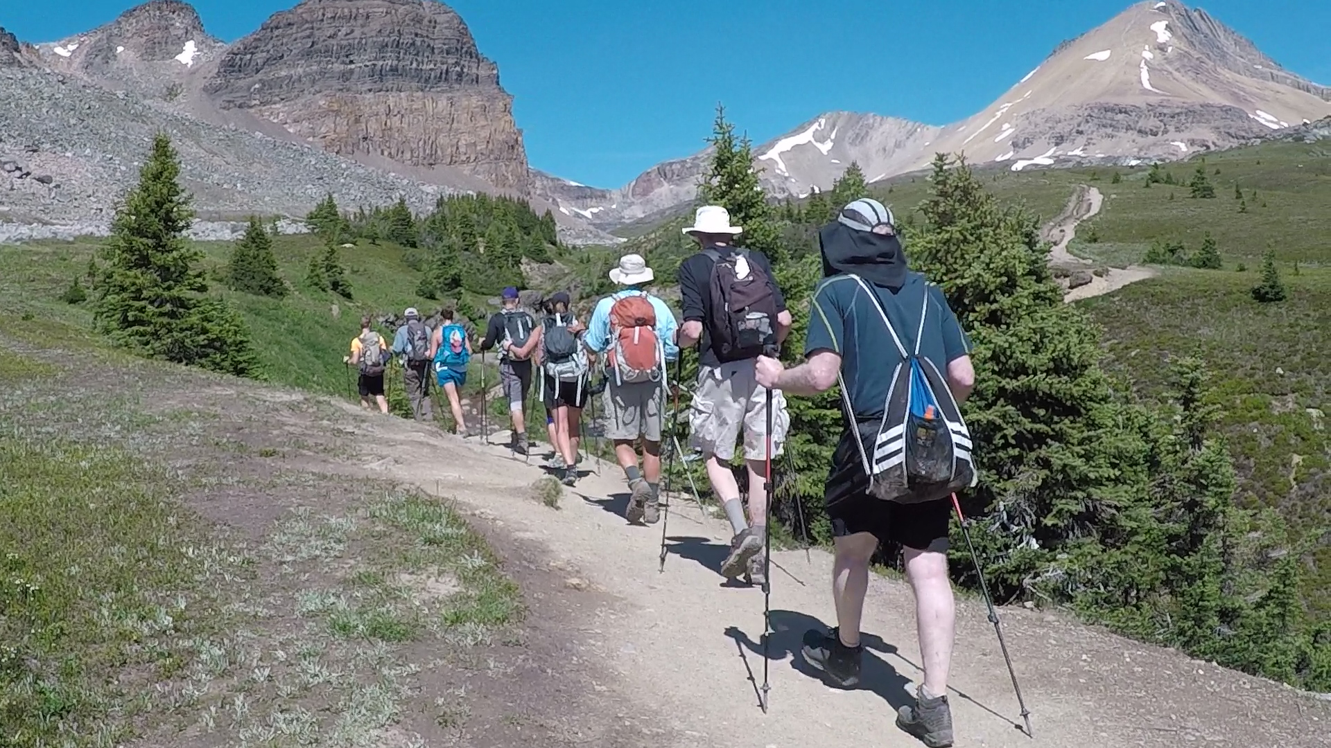 Active travelers enjoy hiking tour near Lake Louise.