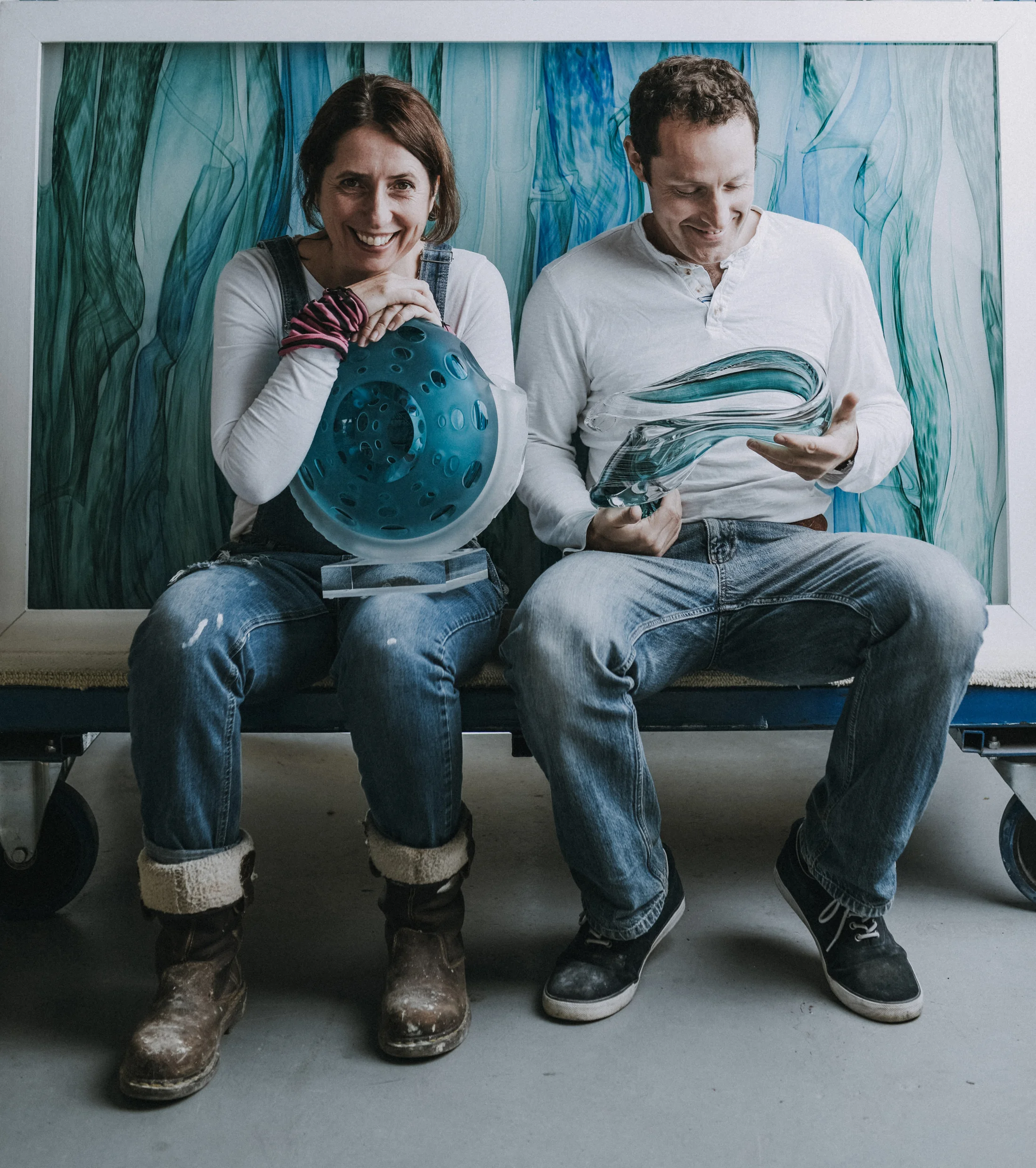 Artists-amanda-notarianni-and-charlie-macpherson-with-some-of-their-work
