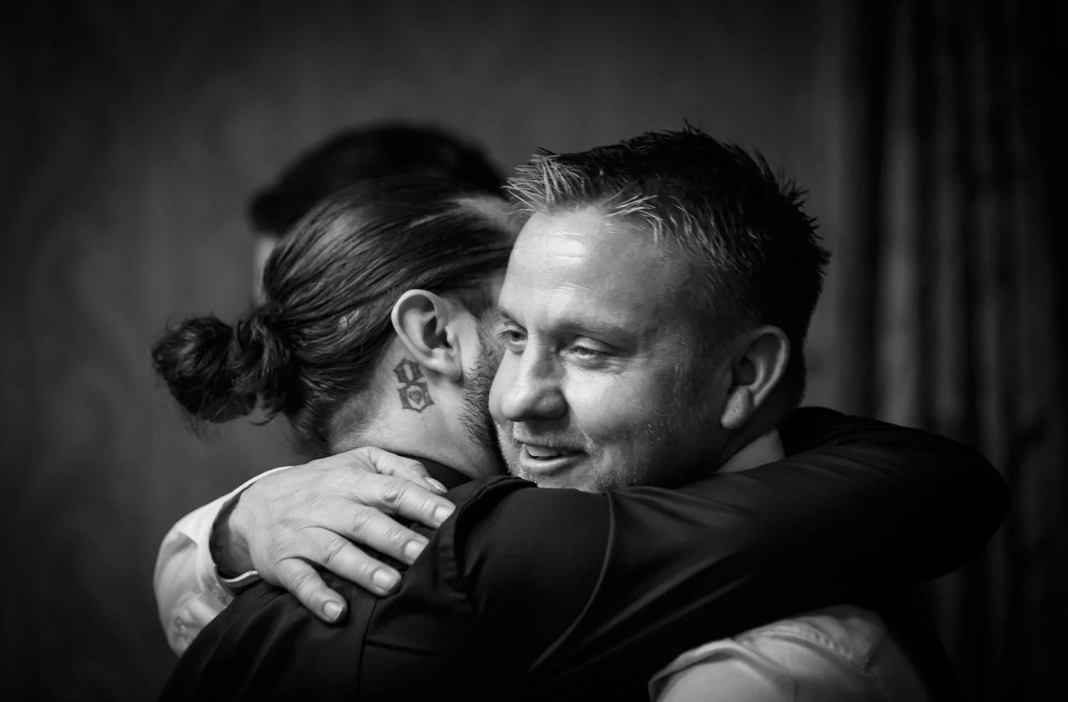 norwich-norfolk-wedding-photographer-groom-hugs-best-man.jpg