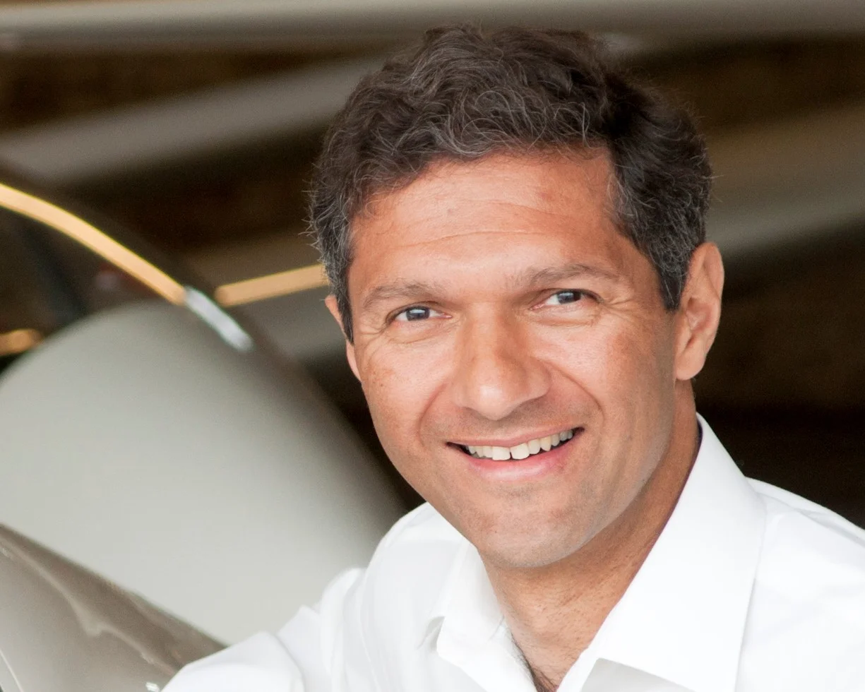 Headshot in hanger crop.jpg