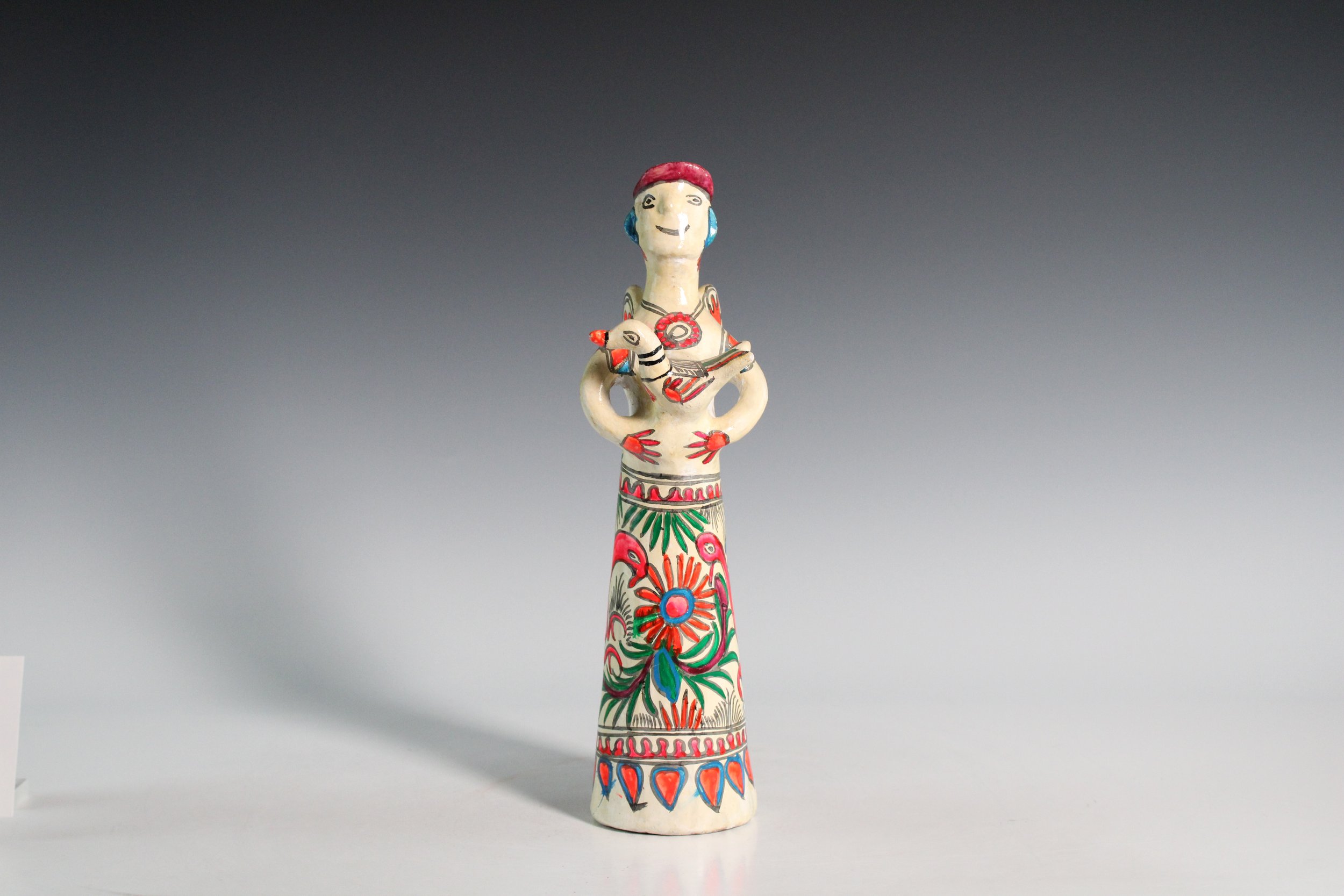 Figurine featuring a Standing Angel Holding a Bird