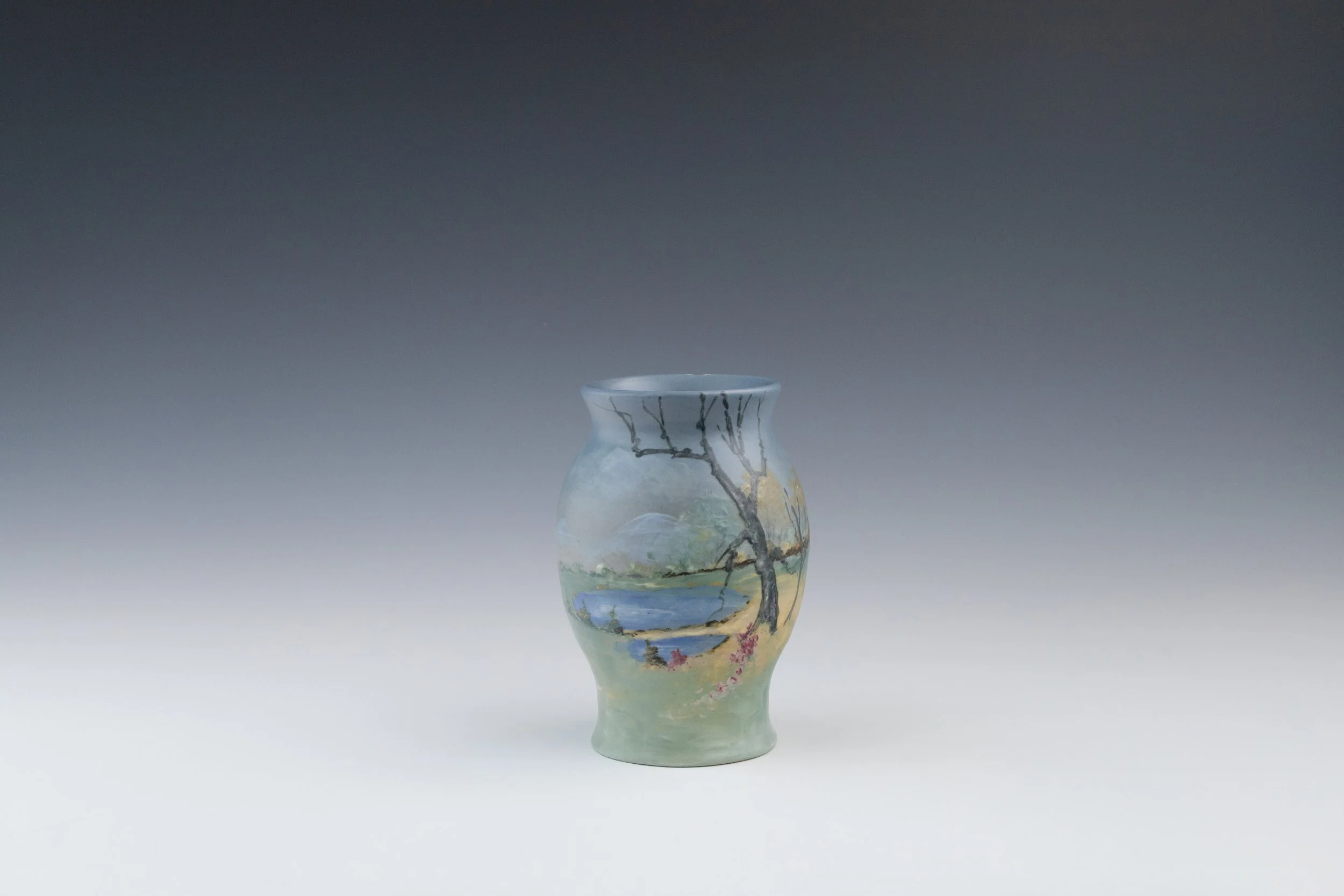 Weller Pottery Company, Hudson (Numbered Scenics) Line Vase #29 Featuring a Fall or Spring Landscape and Waterway, decorated by Sarah Reid McLaughlin (1885-1939), late 1920s, earthenware.
