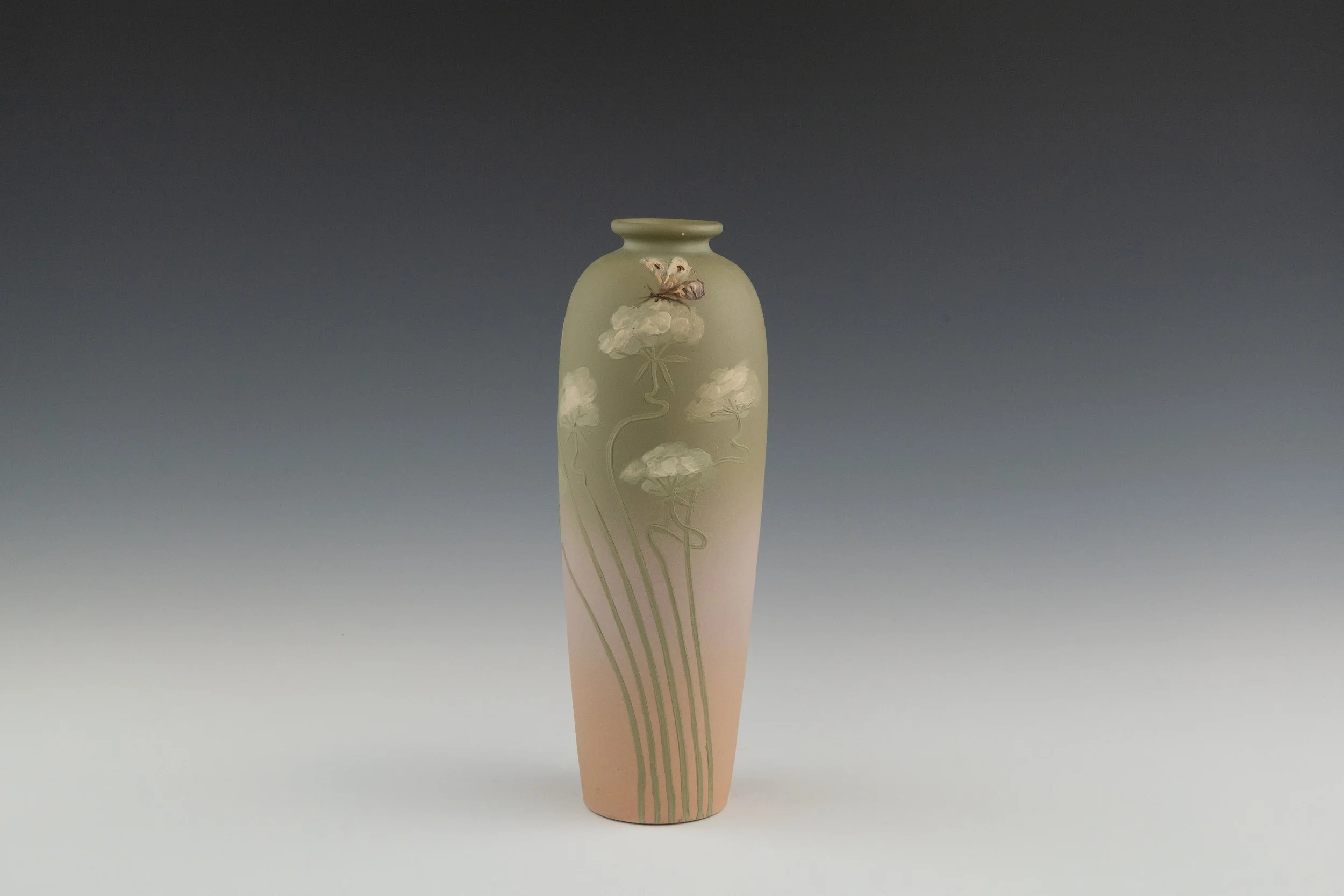 Weller Pottery Company (1872-1948), Unusual Yellow Louwelsa Line Vase Featuring Hollyhocks, decorated by Lillie Catherine Mitchell (1882-1948), Introduced 1896, earthenware. 2023.013.063