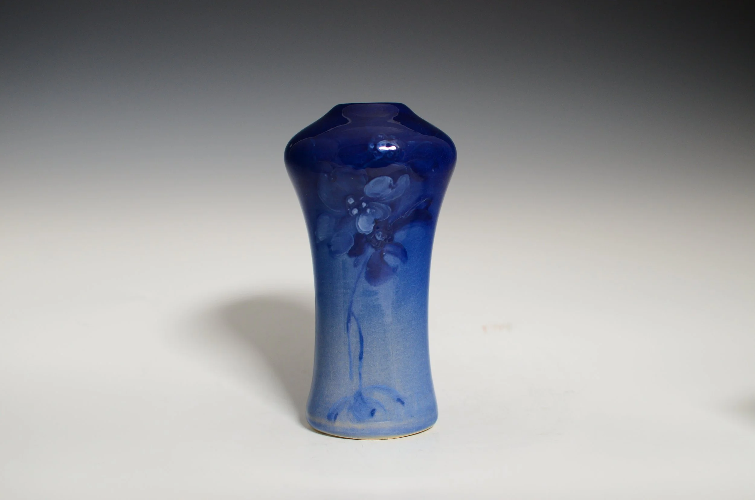 Weller Pottery Company (1872-1948). Blue Louwelsa Vase Featuring a Floral Motif.