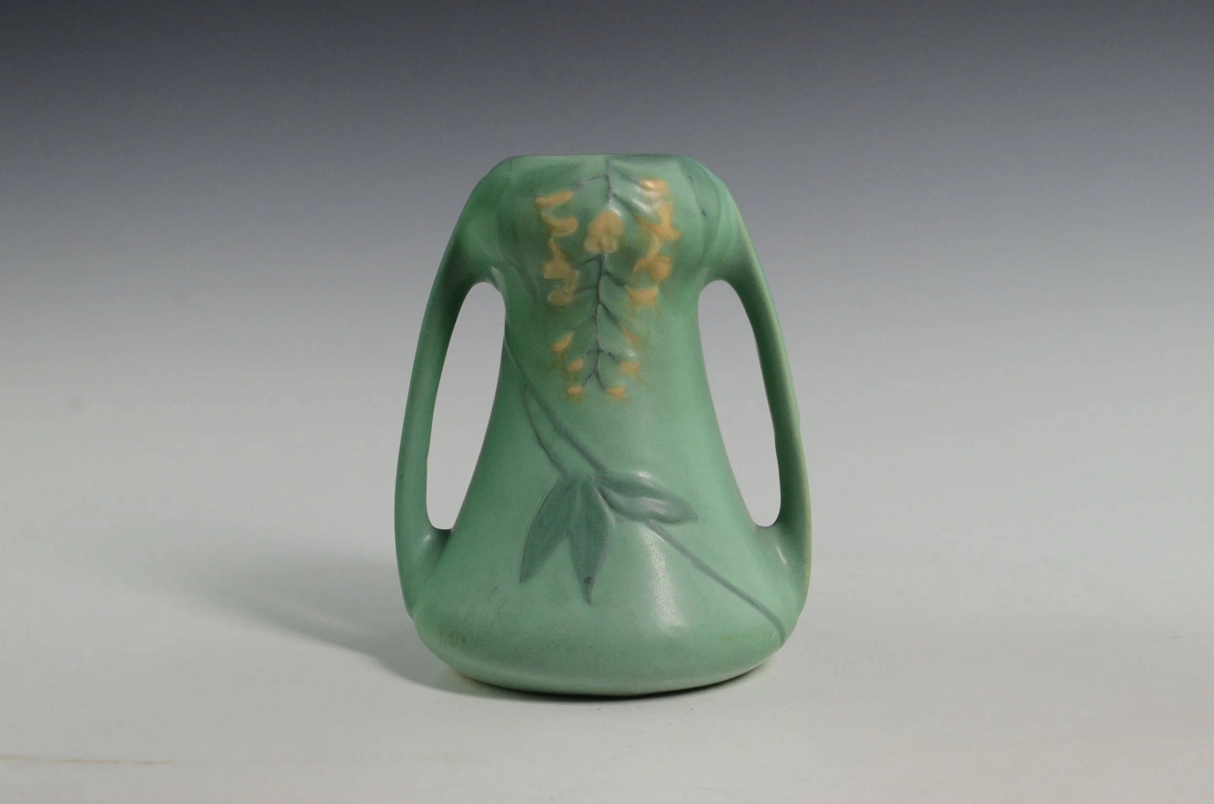 Weller Pottery Company (1872-1948). Matt Ware Vase in Green with Floral Display