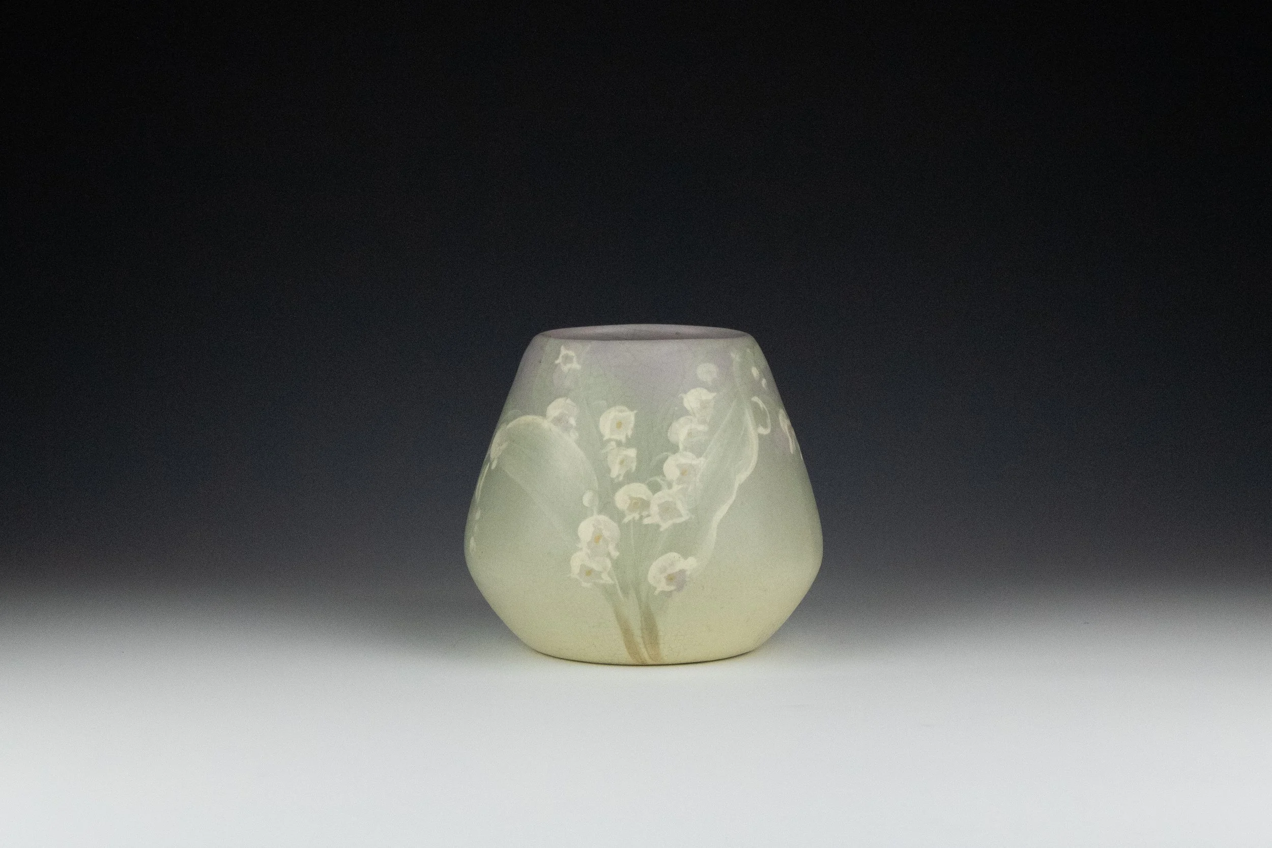 Weller Pottery Company (1872-1948). Matte Eocean Vase Featuring Lilly of the Valley 