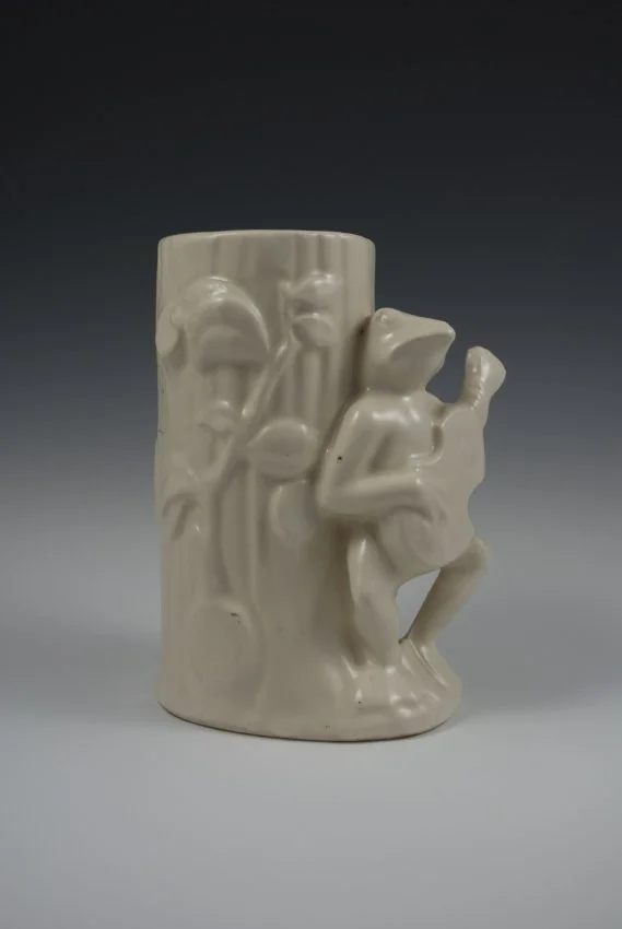 ZMA Puzzler!: Matte White Vase Featuring a Guitar Playing Frog by the Shawnee Pottery Company