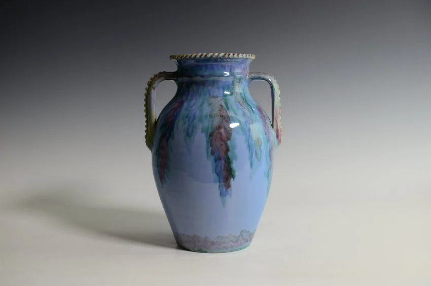 ZMA Puzzler!: Juneau Variant Featuring a Blue Background and Multicolored Drip and Twist Decorations on Rim and Handles